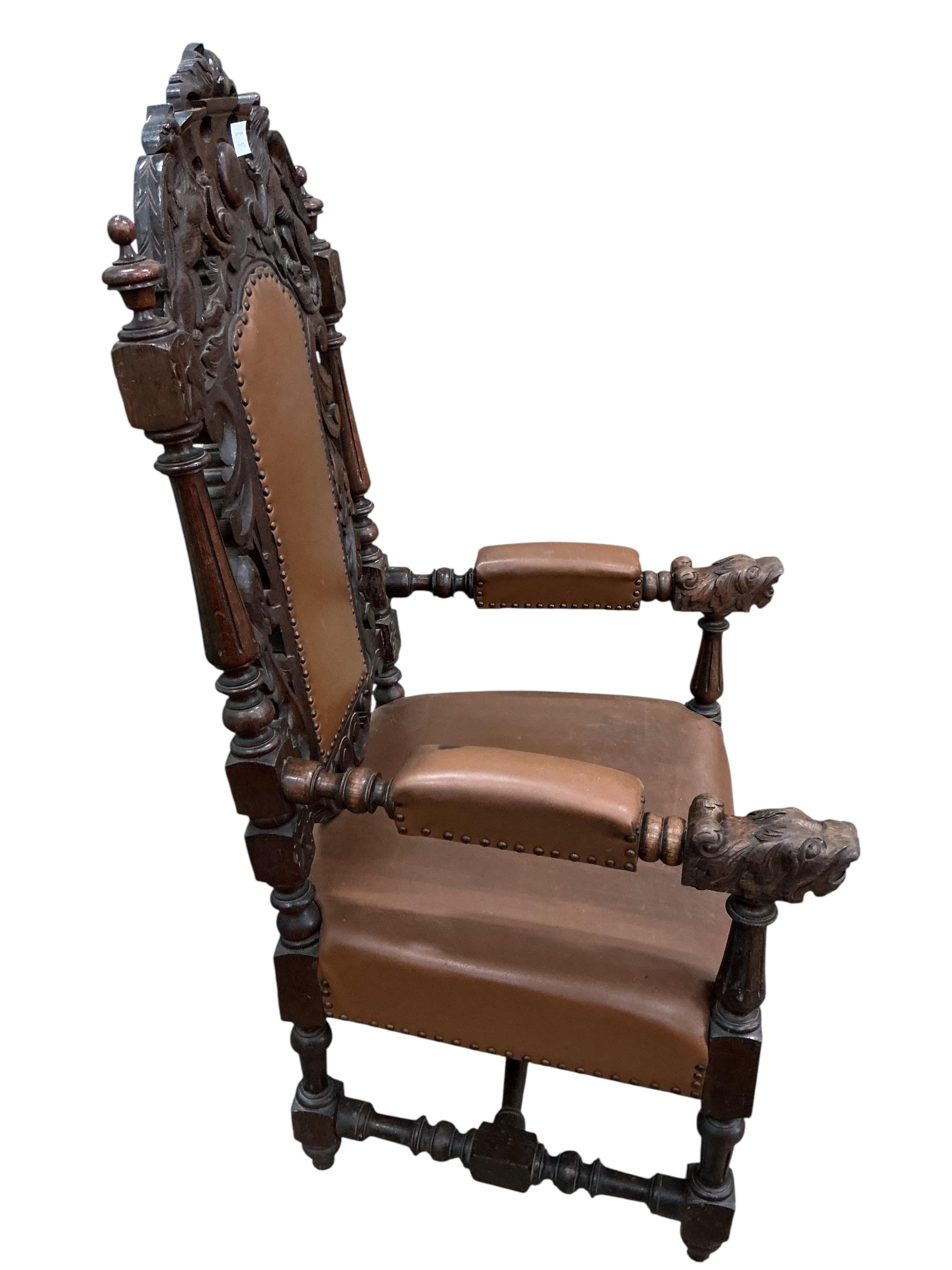 A late Victorian carved oak high backed elbow chair, width 66cm, depth 63cm, height 130cm